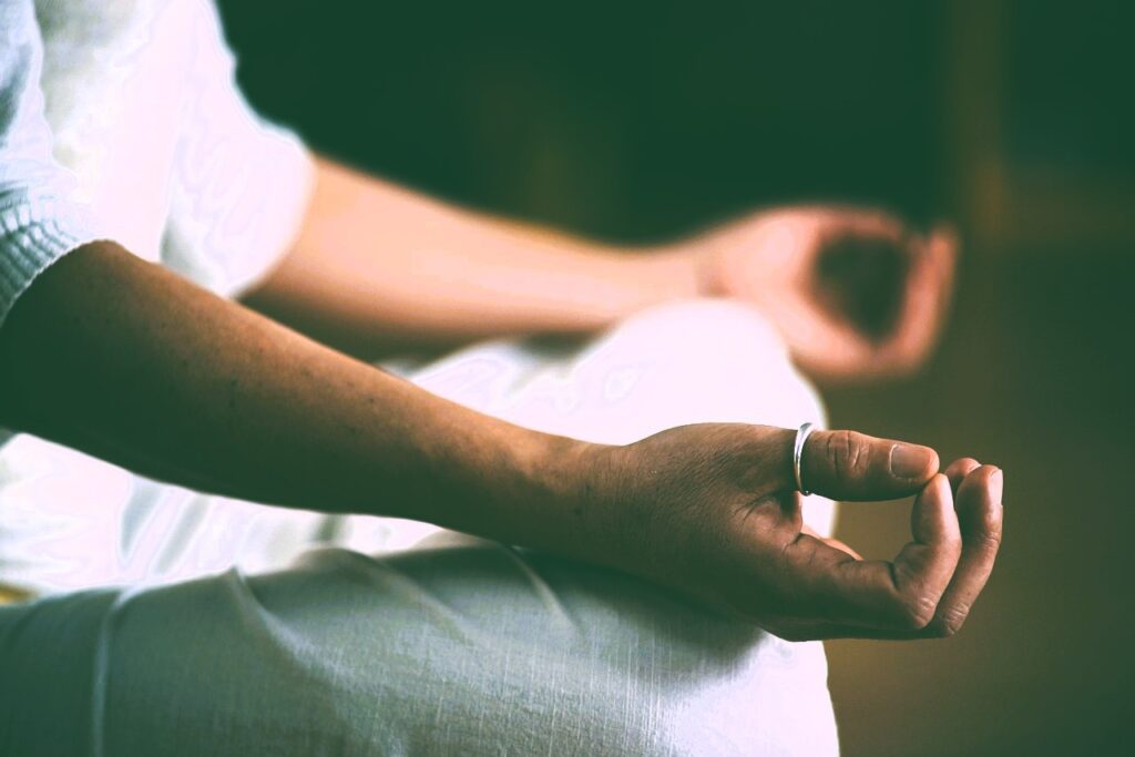 Person meditating in lotus position